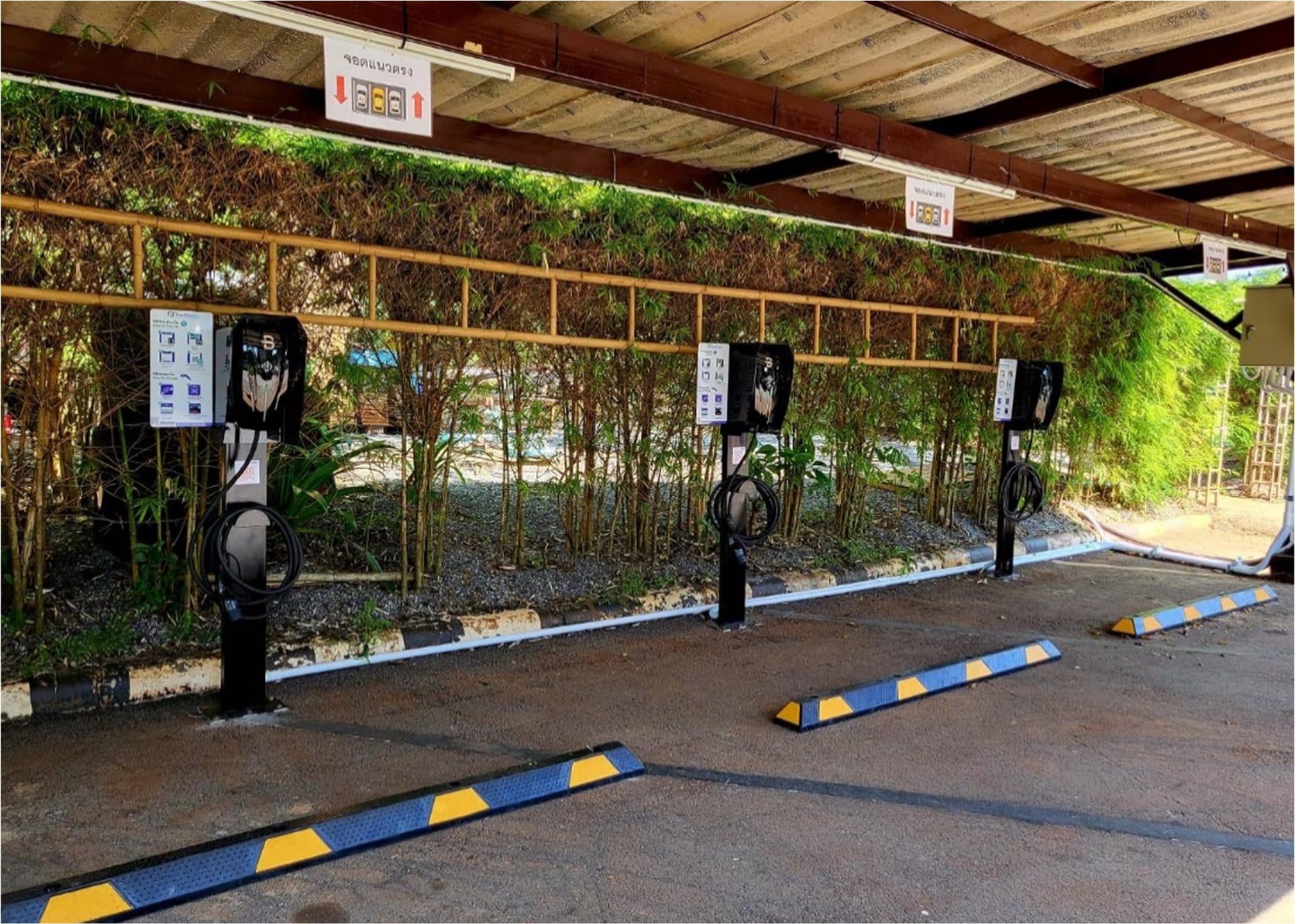 Covered EV charging bay within a resort property