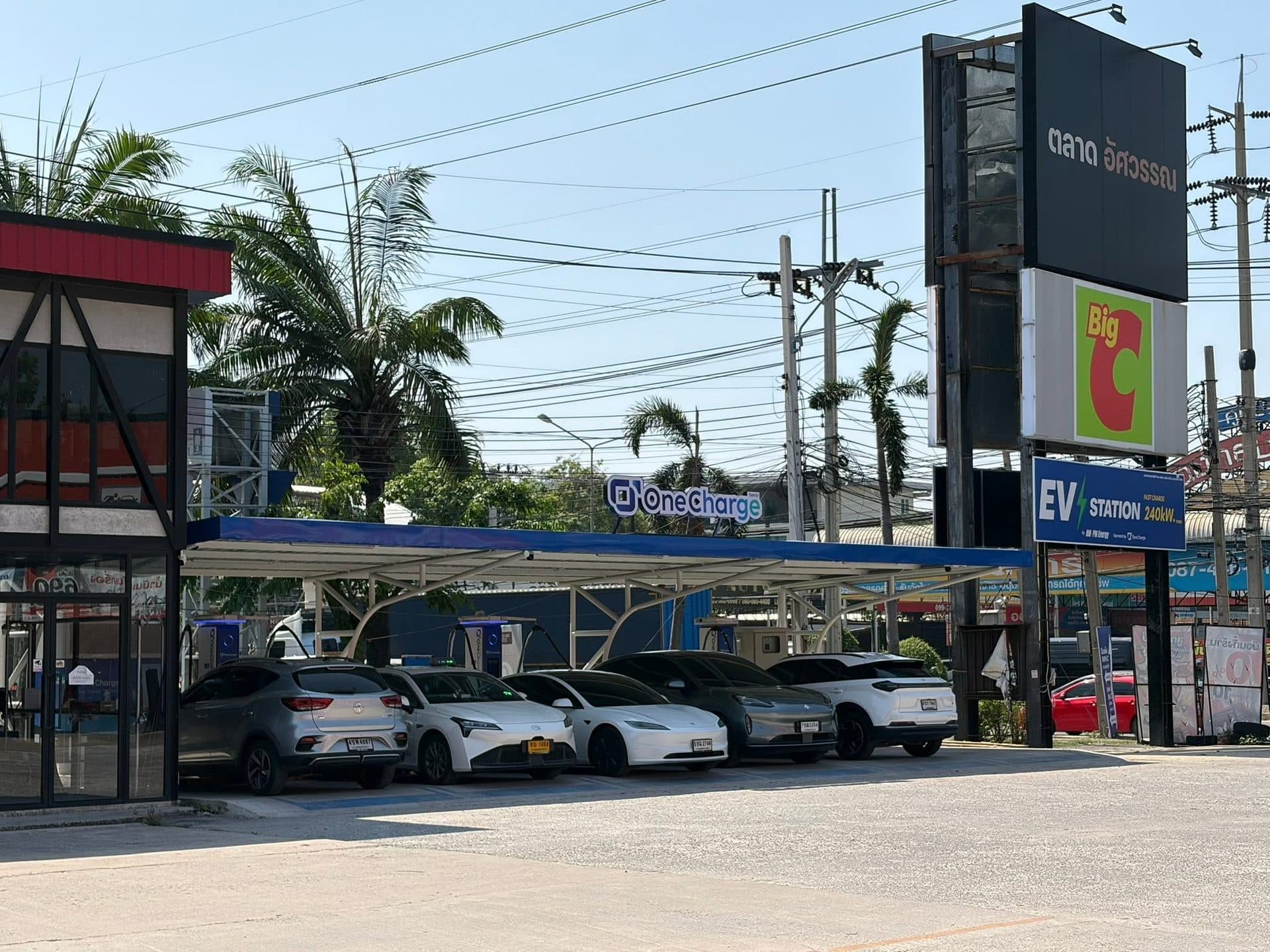 OneCharge 240kW fast-charging station in a market parking area
